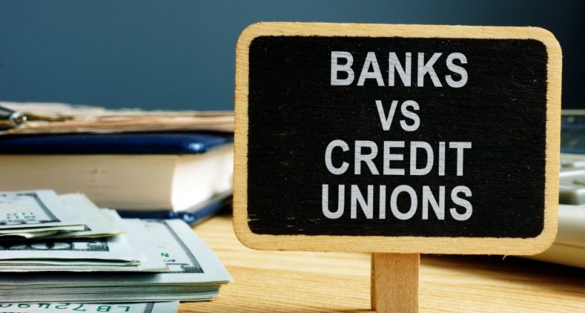 Banks vs Credit Unions concept. Money and ledger.