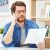 Man calling customer service after unjustified costs complain