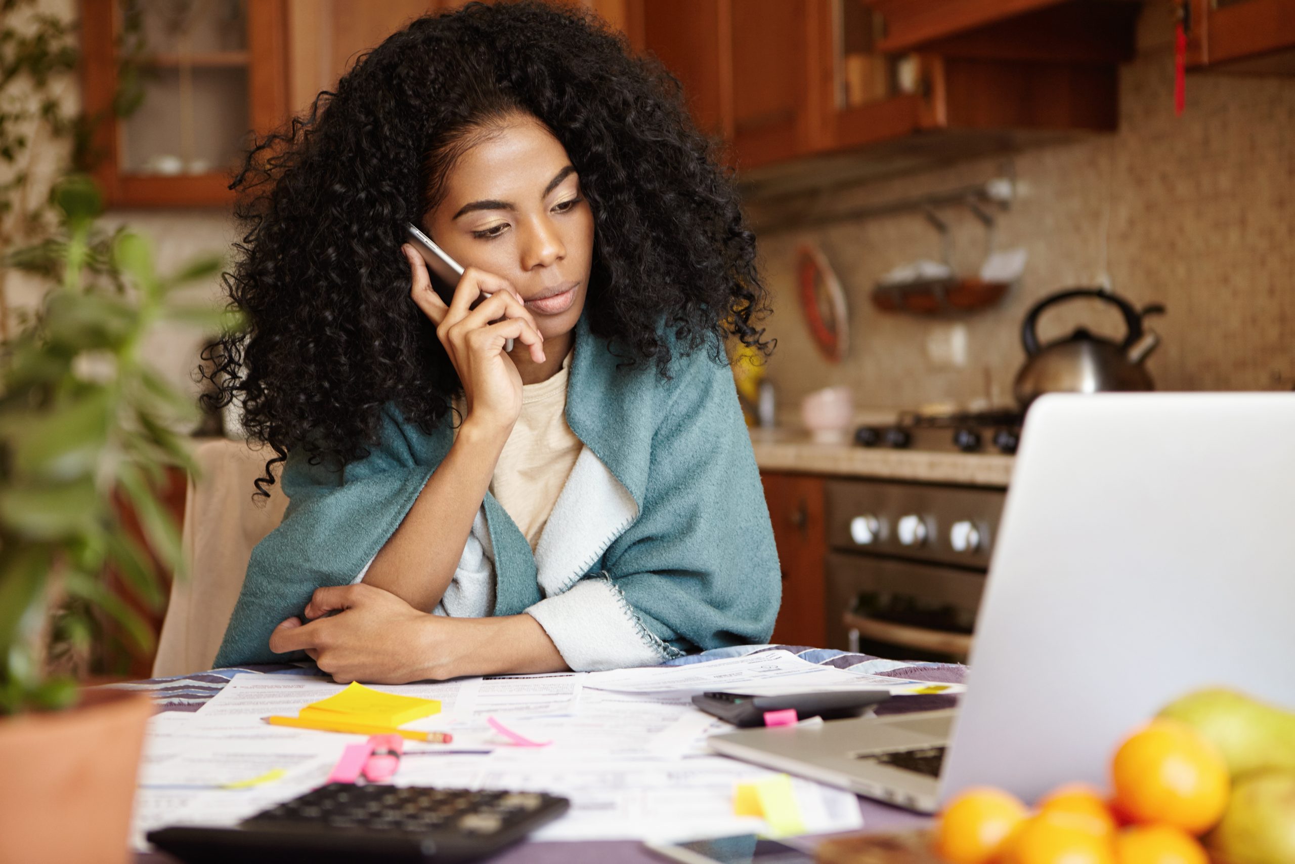 Woman on the phone talking to debt collector