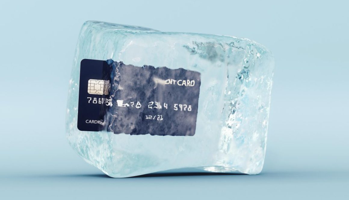 Credit card frozen in ice cube on blue background 3D Rendering