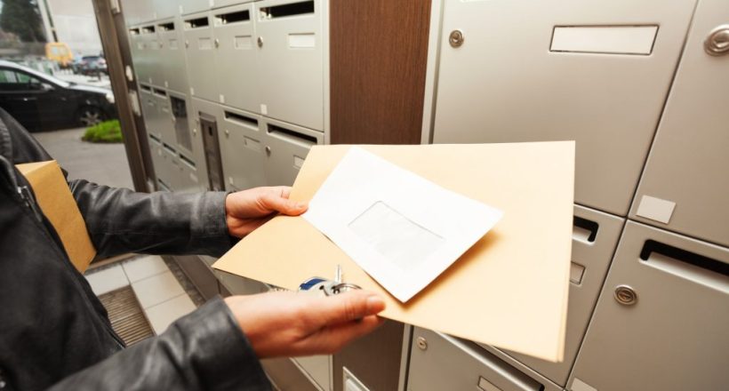 Woman's hands holding envelopes with copy-space