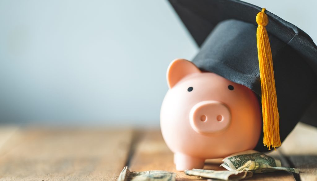 piggy bank With Graduation Cap on old wood,Money saving concept.