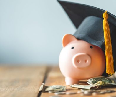 piggy bank With Graduation Cap on old wood,Money saving concept.