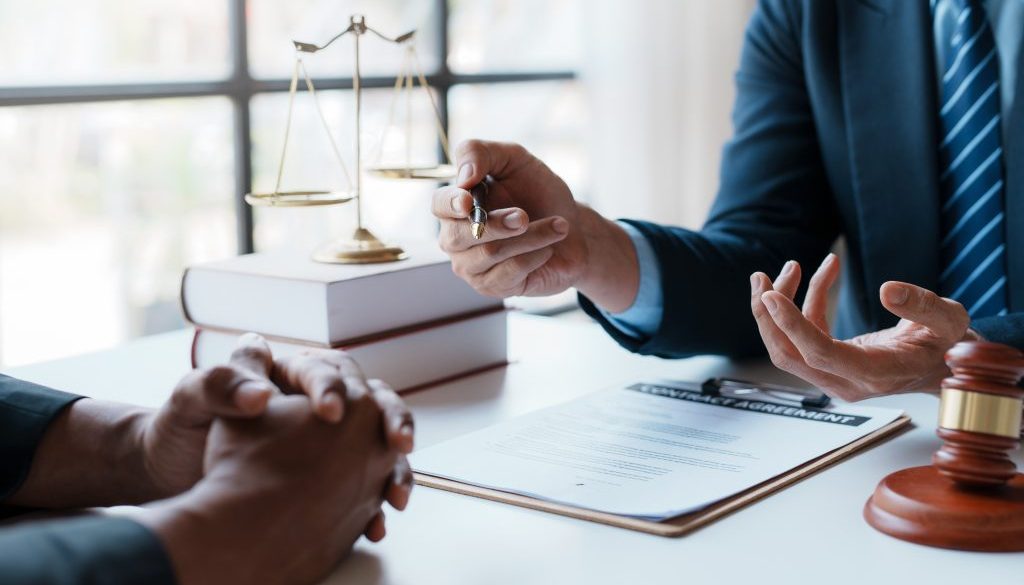Lawyer and client sign variou financial legal contract to mediate with the legal execution department and make appointment for client to mediate debt settlement agreement.