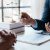 Lawyer and client sign variou financial legal contract to mediate with the legal execution department and make appointment for client to mediate debt settlement agreement.